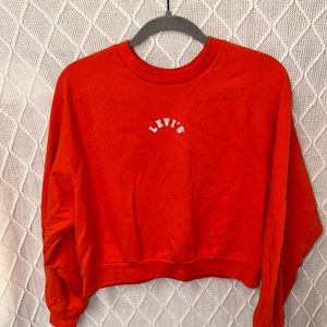 Red cropped Levi’s sweatshirt. Really good condition!